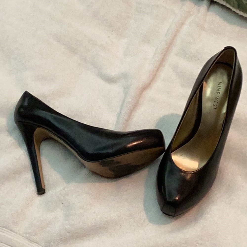 Black leather pumps